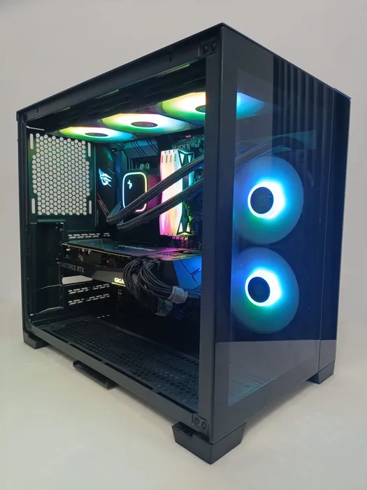 Black desktop PC with blue-lit front fans and a glass side panel