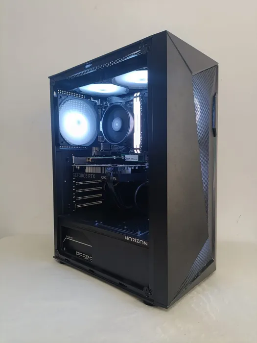 Black mesh-front desktop with blue-lit cooling fans
